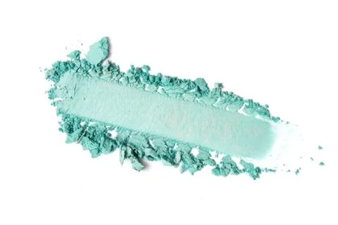 Flat lay of brush stroke. Broken bright teal eyeshadow as sample of cosmetic  Stock Photos