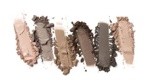 Flat lay of brush strokes. Broken color eyeshadow as samples of cosmetic beau Stock Photos