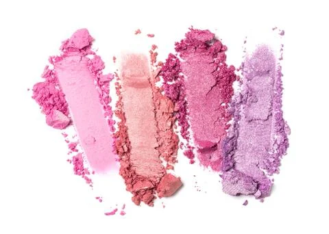 Flat lay of brush strokes. Broken bright color eyeshadow as sample of cosmeti Stock Photos