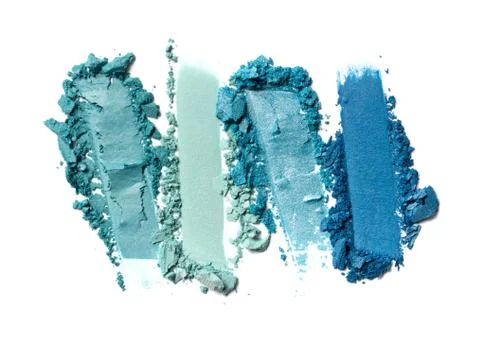 Flat lay of brush strokes. Broken bright teal eyeshadow as samples of cosmeti Foto stock