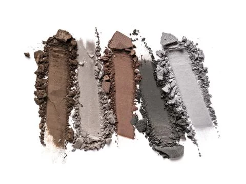 Flat lay of brush strokes. Broken color eyeshadow as samples of cosmetic beau Stock Photos