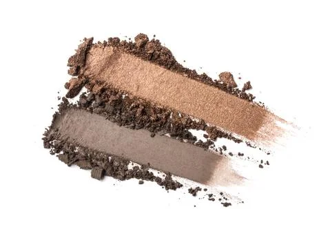 Flat lay of brush strokes. Broken brown eyeshadow as samples of cosmetic beau Stock Photos