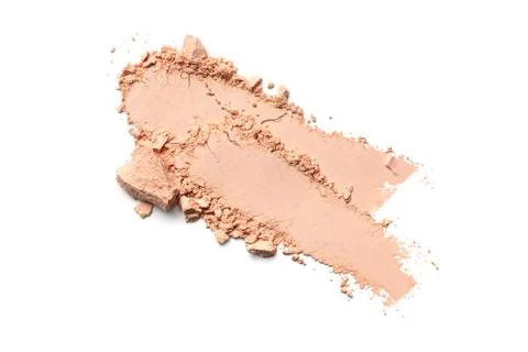 Flat lay of brush strokes. Broken light beige face powder or foundation as sa Stock Photos