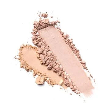 Flat lay of brush strokes. Broken light beige face powder or foundation as sa Stock Photos