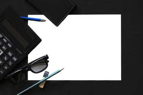 Flat lay with calculator, glasses, notepad, pen Stock Photos