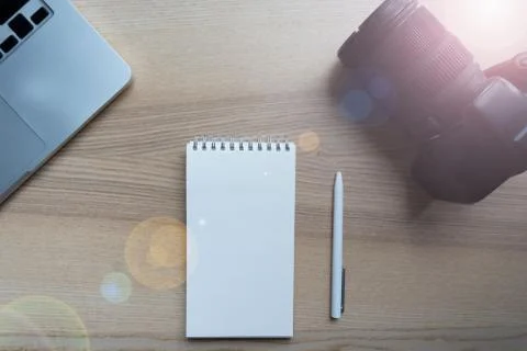 Flat lay of camera, laptop and notebook. . Stock Photos