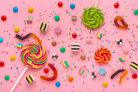Flat lay of candies festive background with assortment of colourful caramel w Stock Photos