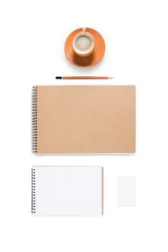 Flat lay with ceramic coffee cup and empty notepads isolated on white Stock Photos