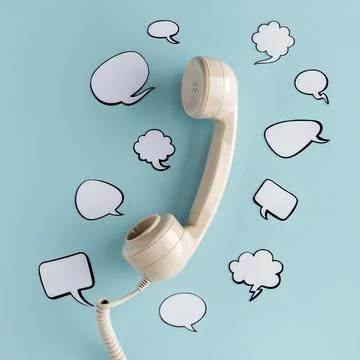 Flat lay chat bubbles with telephone receiver Stock Photos