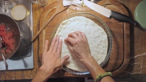 Flat lay of chef  kneading pizza dough in a metal container 動画素材 118209772
