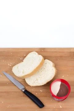 Flat lay chocolate and nuts cream with bread Foto stock