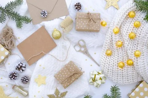 Flat lay chrismas composition with handmade gift box and decoration golden. Stock Photos