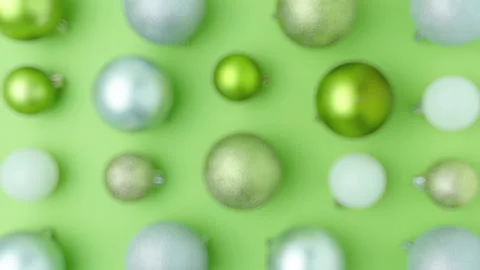 Flat lay with christmas balls on green background Stock Footage 219733710