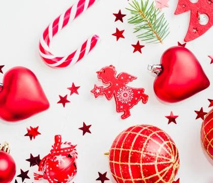 Flat lay Christmas composition with heart, branch, Christmas candy, stripes Photos