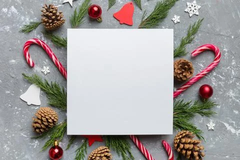Flat lay Christmas composition. square Paper blank, pine tree branches, chr.. Stock Photos