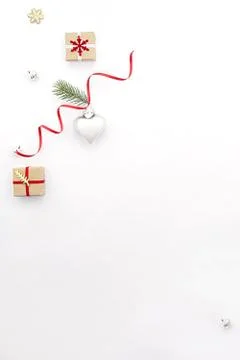 Flat lay Christmas composition on white background with holiday gift boxes, a Stock Photos