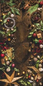 Flat-lay of Christmas layout texture over dark rustic background Stock Photos