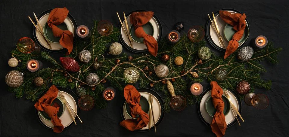 Flat-lay of Christmas table setting on dark table Stock Photos