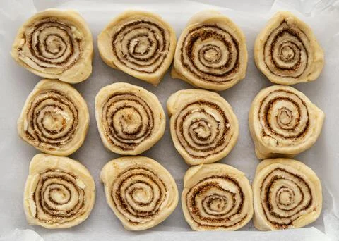 Flat lay cinnamon rolls on tray Stock Photos