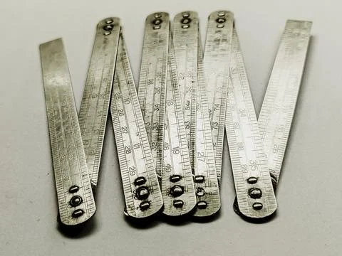Flat Lay of Classic 1 Meter Foldable Aluminum Measuring Tape Foto stock