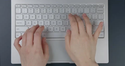 Flat lay. Close-up. Hands of a girl working on a laptop. Stock Footage 154693300