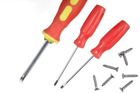 Flat Lay of close up of screwdrivers and screws Stock Photos