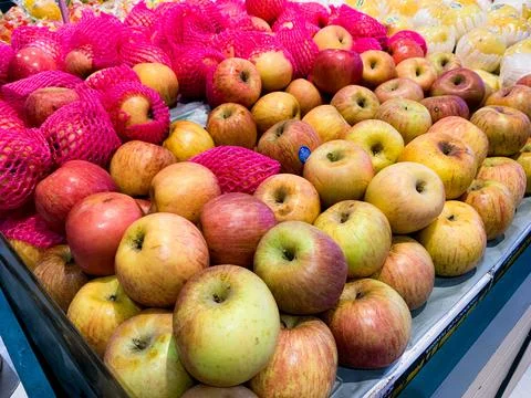 Flat Lay, Close-Up View of Various Types of Apples in a Basket at a Supermark Stock Photos