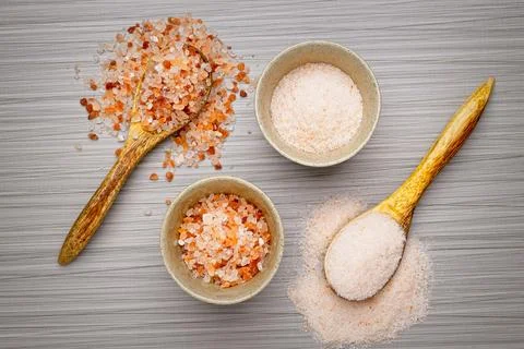 Flat lay of coarse and fine himalayan pink salt. Stock Photos