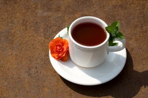 Flat lay Coffee composition  with  white cup  and orange  flower  and fresh l Stock Photos