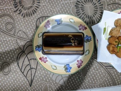 Flat lay coffee pudding cake with layered multi colored on plate Stock Photos