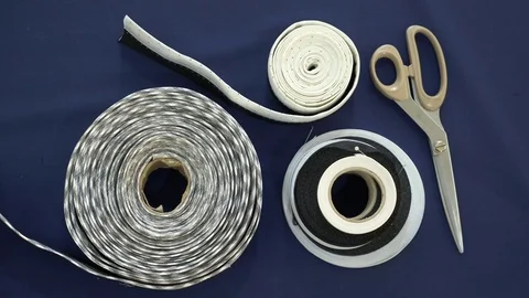 Flat lay. Color fabric, scissors, curl, centimeter, are visible. Stock Footage 78122905