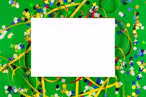 Flat lay of colored greeting card for birthday or carnival with confetti and Stock Photos