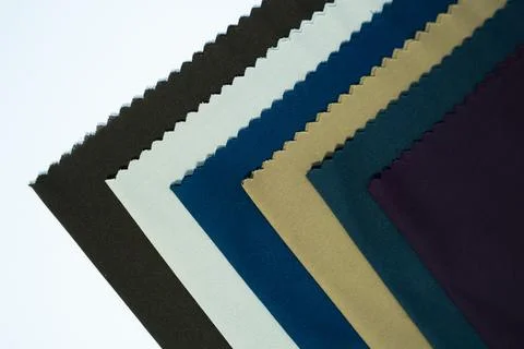 Flat Lay of Colorful Cloth Samples on White Background Stock Photos