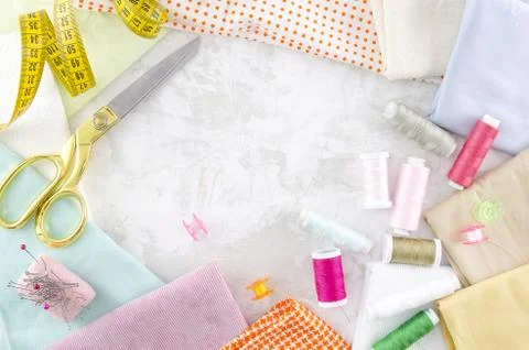 Flat lay colorful tailoring objects on a white background. Space for banner text Stock Photos