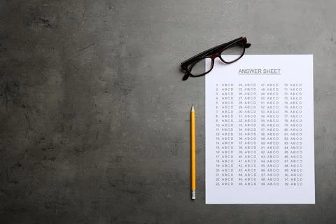 Flat lay composition with answer sheet and space for text on grey background 写真素材