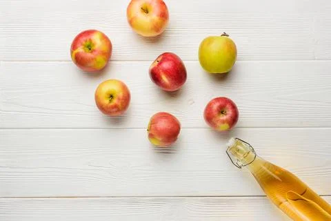 Flat lay composition with apple juice and apples. Stock Photos