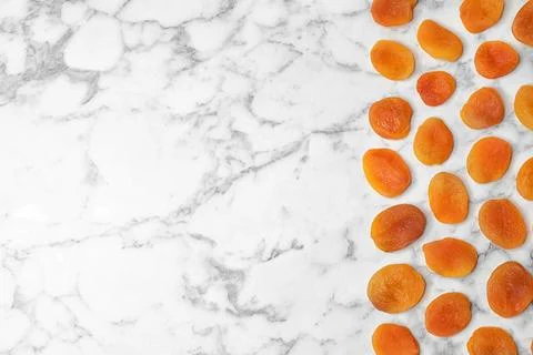Flat lay composition with apricots on marble background, space for text. Drie Stock Photos