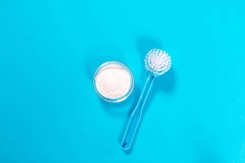 Flat lay composition with baking soda and cleaning supplies on color backgrou Stock Photos