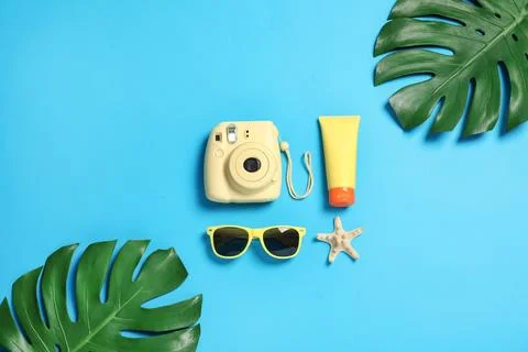 Flat lay composition with beach accessories on color background Stock Photos