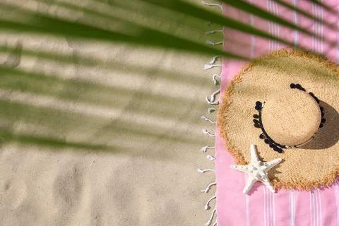 Flat lay composition with beach accessories on sand. Space for text Stock-Fotos