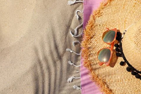Flat lay composition with beach accessories on sand. Space for text Stock-Fotos