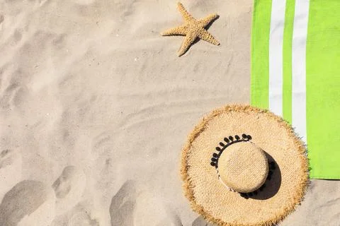 Flat lay composition with beach accessories on sand. Space for text Stock Photos