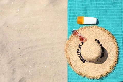 Flat lay composition with beach accessories on sand. Space for text Stock-Fotos