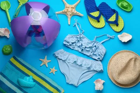 Flat lay composition with beach ball and sand toys on light blue background,  写真素材