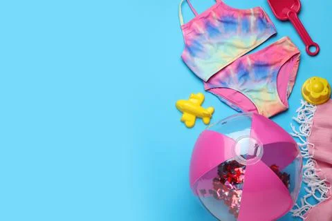 Flat lay composition with beach ball and sand toys on light blue background,  写真素材