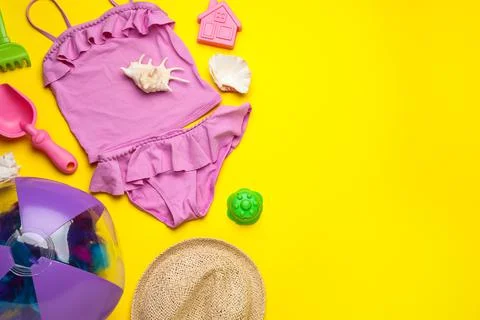 Flat lay composition with beach ball and sand toys on yellow background, spac 写真素材