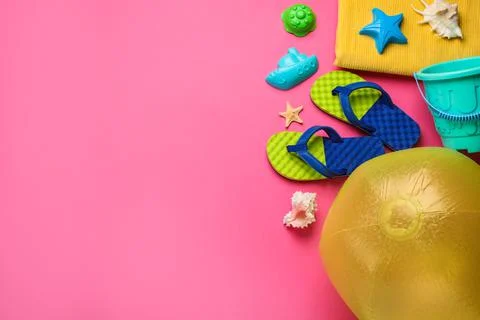 Flat lay composition with beach ball and sand toys on pink background, space  写真素材