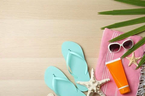 Flat lay composition with beach objects on wooden background. Space for text Stock Photos