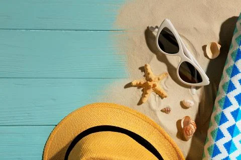 Flat lay composition with beach objects, sand and space for text on wooden ba Stock Photos