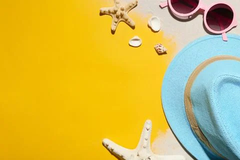 Flat lay composition with beach objects, sand and space for text on color bac Stock-Fotos